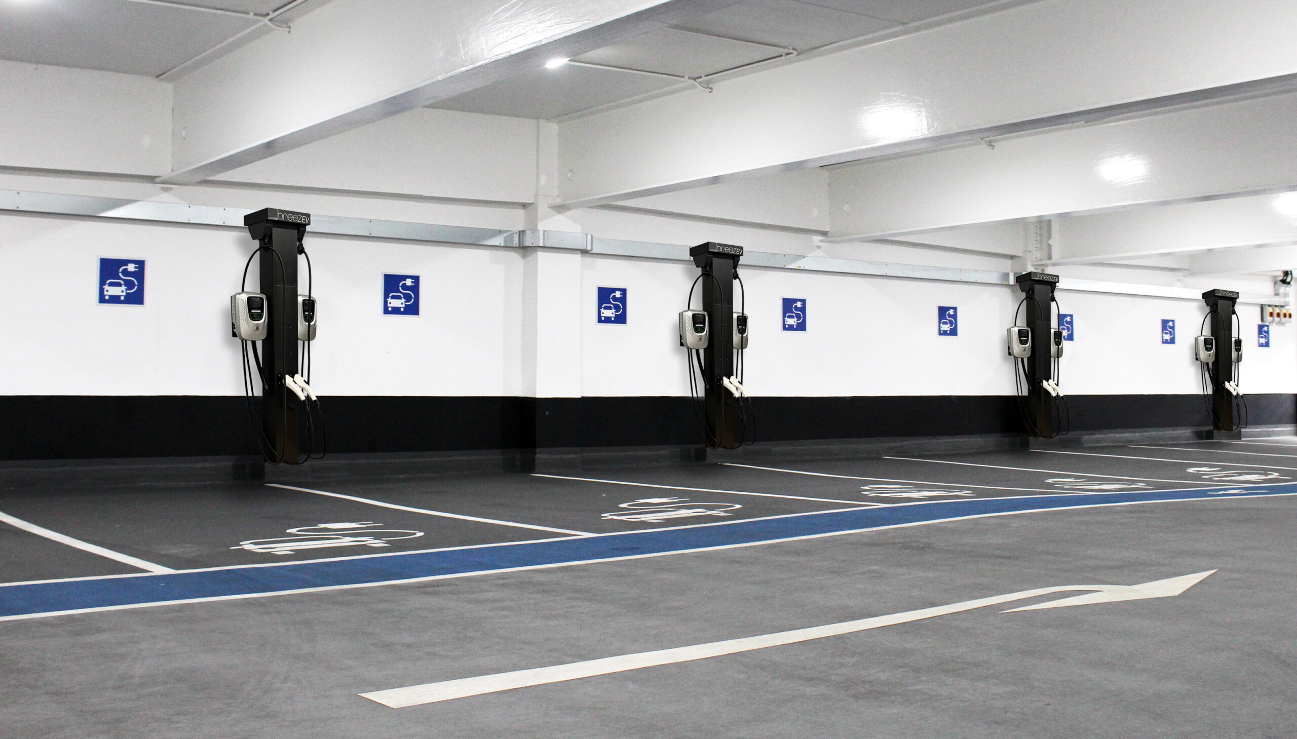 Row of empty electric car charging stations in indoor parking ga